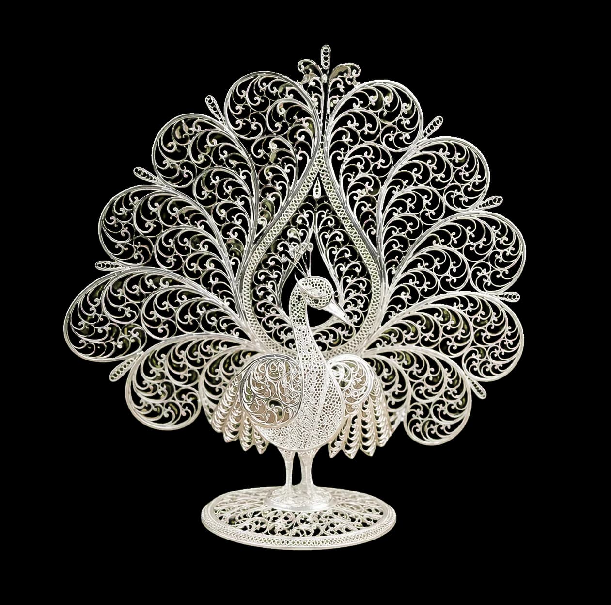 Standing silver filigree peacock with an elaborate fan of curled wire feathers