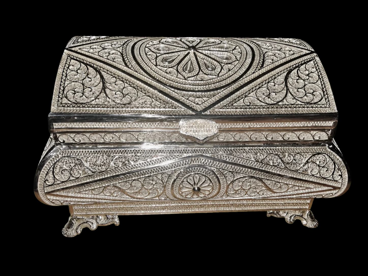 Large silver jewellery chest with geometric panels and curled filigree details