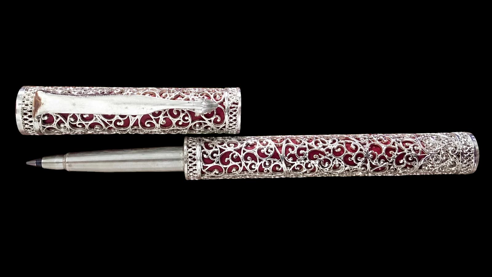 Silver filigree desk set with two pens and a decorative base